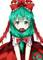 1girl bow candy chocolate chocolate_heart cowboy_shot dress food food_in_mouth frilled_bow frilled_ribbon frills front_ponytail green_eyes green_hair hair_between_eyes hair_bow hair_ribbon hat hat_bow heart highres kagiyama_hina long_hair looking_at_viewer red_bow red_dress red_ribbon ribbon ruu_(tksymkw) short_sleeves simple_background solo spiral standing touhou v_arms white_background