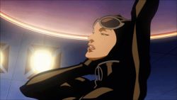 1girl animal_ears animal_hood animated animated_gif batman_(series) bent_over bodysuit breasts cat_ears catwoman cleavage dc_comics female_focus gloves goggles goggles_on_head hood leaning leaning_forward lowres navel open_clothes open_shirt parted_lips pole pole_dancing selina_kyle shirt skin_tight solo spotlight stage standing stripper_pole tight_clothes undressing unzipped whip zipper