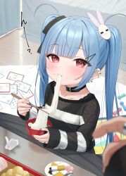 1girl 1other black_bow blue_hair blue_nails blush bow bowl checkerboard_cookie chopsticks closed_mouth commentary_request cookie eating food food_on_face hair_bow hair_ornament hairclip highres holding holding_bowl holding_chopsticks indoors jewelry kotatsu long_hair long_sleeves mochi mochi_trail nail_polish original rabbit_hair_ornament red_eyes ring shirt sleeves_past_wrists solo_focus striped_clothes striped_shirt table tsukiman twintails very_long_hair wooden_floor