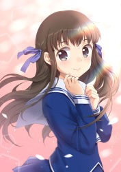 1girl arms_up blue_eyes blue_serafuku blue_skirt brown_hair diffraction_spikes female_focus fingernails fruits_basket hair_blowing hair_ribbon hand_on_own_chest hand_on_own_face honda_tooru lens_flare long_hair looking_at_viewer petals pink_background ribbon sailor_collar school_uniform serafuku skirt smile solo standing sunlight unya_(unya-unya) upper_body very_long_hair white_sailor_collar wind wind_lift