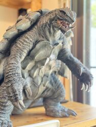 desk fangs full_body gamera gamera_(2015_short) gamera_(series) giant giant_monster highres kadokawa kaiju marza_animation_planet model_kit monster no_humans official_art omnibus_japan open_mouth sculpture sea_monster sharp_teeth takahama_kan teeth tongue turtle tusks yellow_eyes