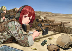 1boy 1girl absurdres anti-materiel_rifle binoculars blonde_hair bolt_action camouflage cheytac_m200 commentary day desert gloves gun headset helmet highres jpc knee_pads kneeling load_bearing_vest looking_at_viewer looking_to_the_side lying military military_combat_uniform military_program military_uniform on_stomach original panasonic_corporation precision_sniper_rifle_(military_program) prototype_design red_eyes red_hair remington_msr rifle scope shadow shell_casing short_hair sky sleeves_rolled_up smile sniper sniper_rifle soldier tablet_pc trigger_discipline unworn_headwear unworn_helmet weapon