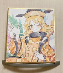 1girl ;) black_hat blonde_hair commentary constellation_print detached_sleeves drum energy hat highres instrument long_sleeves looking_at_viewer matara_okina mozukuzu_(manukedori) one_eye_closed orange_sleeves orange_tabard parted_bangs shikishi shirt smile solo tabard touhou traditional_media upper_body waving white_shirt wide_sleeves yellow_eyes