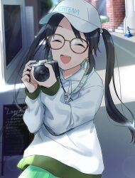 1girl baseball_cap black_hair blush camera cat closed_eyes earrings english_text glasses green_skirt hat highres holding holding_camera hood hoodie hoop_earrings idolmaster idolmaster_shiny_colors jewelry long_hair long_sleeves menu_board mitsumine_yuika open_mouth pachiko print_hat road skirt smile solo street traffic_cone white_hat white_hoodie