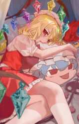 1girl blonde_hair blue_hair character_doll crystal crystal_wings doll flandre_scarlet hat hat_ribbon highres looking_at_viewer mob_cap open_mouth pillow_bite puffy_short_sleeves puffy_sleeves red_eyes red_vest remilia_scarlet ribbon shirt short_hair short_sleeves side_ponytail sitting skirt solo taninasi touhou vest wings yukkuri_shiteitte_ne