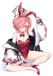 1girl ahoge animal_ears asymmetrical_bangs bandaid bandaid_on_knee bandaid_on_leg bare_legs blue_archive bow bowtie braid detached_collar flat_chest haruyuki_(yukichasoba) highres indian_style jacket leotard mole mole_under_eye neru_(blue_archive) neru_(bunny)_(blue_archive) one_eye_closed orange_hair oversized_breast_cup playboy_bunny print_jacket rabbit_ears red_eyes red_leotard simple_background single_braid sitting solo strapless strapless_leotard sukajan tag traditional_bowtie white_background