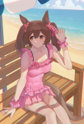 1girl absurdres beach blush breasts brown_hair cleavage collarbone commentary_request hair_between_eyes hair_ornament highres horse_girl looking_at_viewer navel ocean outdoors parasol short_twintails sitting smart_falcon_(umamusume) smile swimsuit twintails umamusume umbrella yuzpoi