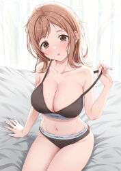1girl absurdres bed_sheet blush breasts brown_eyes brown_hair brown_panties brown_sports_bra cleavage clothes_writing collarbone commentary_request head_tilt highres idolmaster idolmaster_shiny_colors indoors large_breasts looking_at_viewer medium_hair on_bed open_mouth panties pulling_own_clothes sakuragi_mano short_bangs solo sports_bra stomach strap_pull sulgi_park underwear