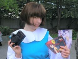 Rule 34 | 1girl, brown hair, camera, cosplay, cosplay photo, fuurinkan high school uniform, photo (medium), ranma 1/2, saotome ranma, tendou akane, tendou akane (cosplay), tree